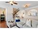 Comfortable living room with a staircase and a bar that opens to the kitchen at 2367 Millhaven Se St, Smyrna, GA 30080