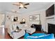Bright living room features a fireplace, ceiling fan and flows into the kitchen through an arched servery at 2367 Millhaven Se St, Smyrna, GA 30080