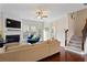 Cozy living room with fireplace, hardwood floors, and comfortable seating arrangement at 2367 Millhaven Se St, Smyrna, GA 30080