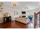 Elegant living room with fireplace, wood floors, wine bar, and comfortable seating at 2367 Millhaven Se St, Smyrna, GA 30080