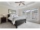Spacious main bedroom with a tray ceiling, large windows, and plush carpeting at 2367 Millhaven Se St, Smyrna, GA 30080