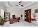 This office features a ceiling fan, office furniture, and shelving for decor at 2367 Millhaven Se St, Smyrna, GA 30080