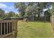 Large backyard with mature trees, play area, shed and green lawn at 3135 Bluebird Ln, Decatur, GA 30032