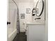 Stylish bathroom with black and white design including a shower and vanity at 3135 Bluebird Ln, Decatur, GA 30032