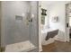 Modern bathroom offers glass shower, freestanding tub and a view into the main bedroom at 3135 Bluebird Ln, Decatur, GA 30032