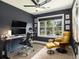Bright home office with large windows and a comfortable yellow chair at 3135 Bluebird Ln, Decatur, GA 30032