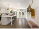 Modern white kitchen featuring stainless steel appliances, a central island, and lots of natural light at 3135 Bluebird Ln, Decatur, GA 30032