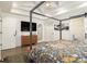 Tranquil bedroom suite with a four-poster bed, tray ceiling, and ample natural light at 3135 Bluebird Ln, Decatur, GA 30032