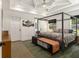 Bright main bedroom boasts tray ceilings, natural light and elegant furnishings at 3135 Bluebird Ln, Decatur, GA 30032