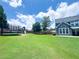 Spacious backyard featuring a trampoline, play set, lush lawn and access to the house at 3804 Bay Orchard Lane, Loganville, GA 30052