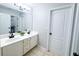 Bright bathroom showcasing double sinks, white cabinets and tile flooring at 3804 Bay Orchard Lane, Loganville, GA 30052