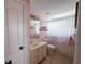 Cozy bathroom featuring tiled floors, bathtub, and shower with pink wall at 3804 Bay Orchard Lane, Loganville, GA 30052