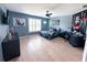 Comfortable bedroom featuring light wood floors, ceiling fan, and great decor at 3804 Bay Orchard Lane, Loganville, GA 30052