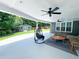 Spacious covered patio with ceiling fans, comfortable seating, and a backyard view including a shed at 3804 Bay Orchard Lane, Loganville, GA 30052