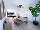 Bright dining area with vaulted ceilings, shutters, a large table and views of the kitchen at 3804 Bay Orchard Lane, Loganville, GA 30052