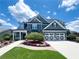 Beautiful two-story home with a well-manicured lawn, colorful flower beds and a two-car garage at 3804 Bay Orchard Lane, Loganville, GA 30052