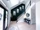 Bright and modern foyer with statement wall, staircase, and contemporary accents at 3804 Bay Orchard Lane, Loganville, GA 30052