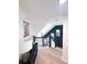 Well-lit hallway with elegant finishes, fresh paint, and hardwood flooring at 3804 Bay Orchard Lane, Loganville, GA 30052