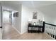 Well-lit hallway with elegant finishes, fresh paint, and hardwood flooring at 3804 Bay Orchard Lane, Loganville, GA 30052
