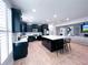 Spacious open-concept kitchen with black cabinets, white countertops, and center island with bar seating at 3804 Bay Orchard Lane, Loganville, GA 30052