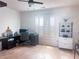 Clean home office with bright natural light, plantation shutters, and light wood flooring at 3804 Bay Orchard Lane, Loganville, GA 30052