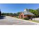 Community pool house with brick exterior, surrounded by a black fence and parking spaces at 3804 Bay Orchard Lane, Loganville, GA 30052