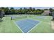 Outdoor tennis and pickleball courts with green and blue playing surfaces and lush green surroundings at 3804 Bay Orchard Lane, Loganville, GA 30052