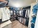 Organized walk-in closet featuring custom shelving, hanging rods and plenty of space for clothes and accessories at 3804 Bay Orchard Lane, Loganville, GA 30052
