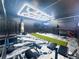 Customized workout room featuring gym equipment, green athletic turf, and unique hexagonal overhead lighting at 3804 Bay Orchard Lane, Loganville, GA 30052