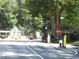 Community entrance with trees and signage at 3828 Woodridge Way, Tucker, GA 30084