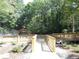 Wooden walkway leading to community amenities, providing a scenic and accessible path for residents at 3828 Woodridge Way, Tucker, GA 30084