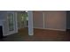Living room featuring hardwood floors, white trim, and a fireplace at 3828 Woodridge Way, Tucker, GA 30084