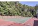 Outdoor tennis court offers residents recreational opportunities and a place to enjoy an active lifestyle at 3828 Woodridge Way, Tucker, GA 30084