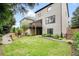A lush green lawn highlights the home's backyard, along with a wooden deck and stairs at 132 Cornerstone Pl, Woodstock, GA 30188