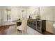 Dining area with a wine cooler, elegant furniture, and natural light at 132 Cornerstone Pl, Woodstock, GA 30188