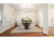 Formal dining room featuring elegant decor, a stylish table, and hardwood floors at 132 Cornerstone Pl, Woodstock, GA 30188