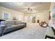 Open living room with mini-bar and light-colored carpet at 132 Cornerstone Pl, Woodstock, GA 30188
