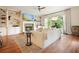 Bright living room featuring hardwood floors, a fireplace, built-in shelves, and large windows at 132 Cornerstone Pl, Woodstock, GA 30188