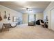 Large, bright living room with guitars, ceiling fan and lots of space at 132 Cornerstone Pl, Woodstock, GA 30188