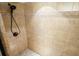 Walk-in shower featuring neutral tile work and bronze shower head at 132 Cornerstone Pl, Woodstock, GA 30188