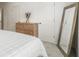 Comfortable bedroom featuring a queen-size bed, a dresser, and a large mirror at 2016 Bixby Byway Se Dr, Atlanta, GA 30317