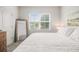 Bedroom featuring a large window for natural light and a neutral color palette at 2016 Bixby Byway Se Dr, Atlanta, GA 30317