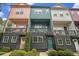Townhomes with colorful exteriors, balconies, and well-maintained landscaping offer curb appeal at 2016 Bixby Byway Se Dr, Atlanta, GA 30317