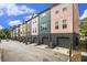 Colorful townhome exterior with garages, and blue sky at 2016 Bixby Byway Se Dr, Atlanta, GA 30317