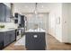A modern kitchen featuring stainless steel appliances, white countertops and stylish pendant lighting at 2016 Bixby Byway Se Dr, Atlanta, GA 30317