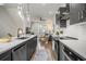 Modern kitchen with stainless steel appliances, white countertops, and gray cabinets open to the living room at 2016 Bixby Byway Se Dr, Atlanta, GA 30317
