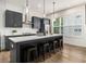 Stylish kitchen features gray cabinetry, a center island with seating, and modern pendant lighting at 2016 Bixby Byway Se Dr, Atlanta, GA 30317