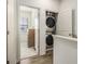 Convenient laundry area with stacked washer and dryer located near the bedrooms at 2016 Bixby Byway Se Dr, Atlanta, GA 30317