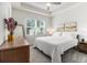 Bright main bedroom featuring a tray ceiling, a large window and neutral decor at 2016 Bixby Byway Se Dr, Atlanta, GA 30317