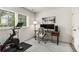 Bright home office featuring large windows, a modern desk setup, and stylish decor at 2016 Bixby Byway Se Dr, Atlanta, GA 30317